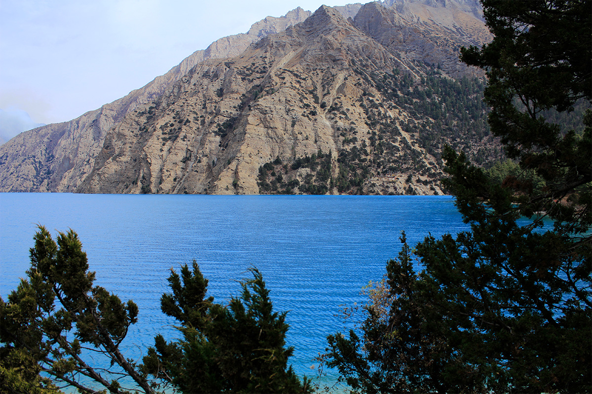 Vibrant blue Shey Phoksundo Lake During Monsoon